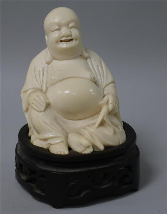 A Chinese ivory figure of Budai wood stand